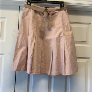 Light pink with brown trim skirt.